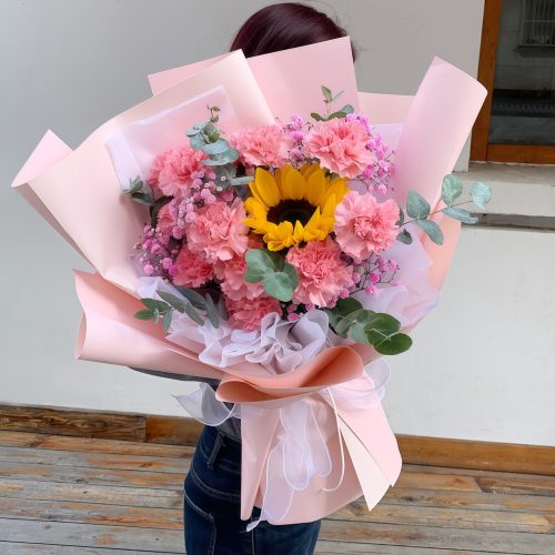 11 Pink Carnations 1 Sunflower Bouquet – Sweet Charm Sweet Charm: 11 Pink Carnations & Sunflower Bouquet