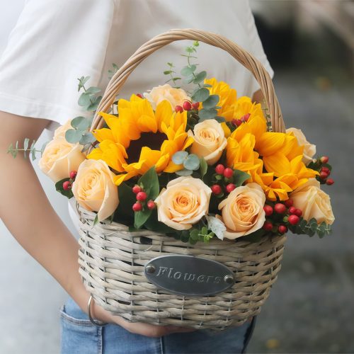 2 Sunflowers 19 Roses Flower Basket – Warm Blessings 2 Sunflowers & 19 Champagne Roses Flower Basket | Warm Blessings